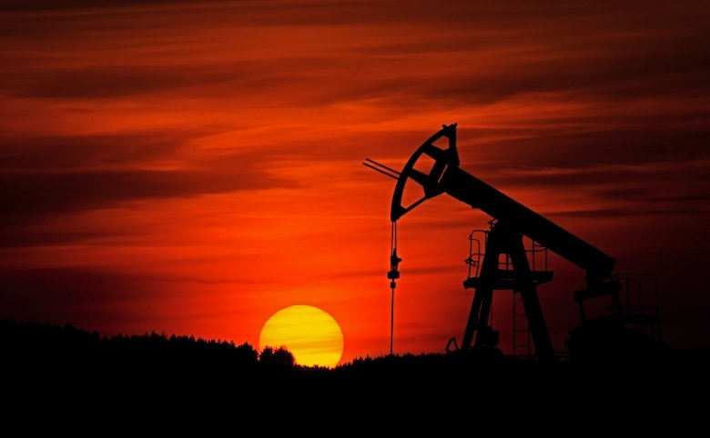 An oil extraction site at sunset